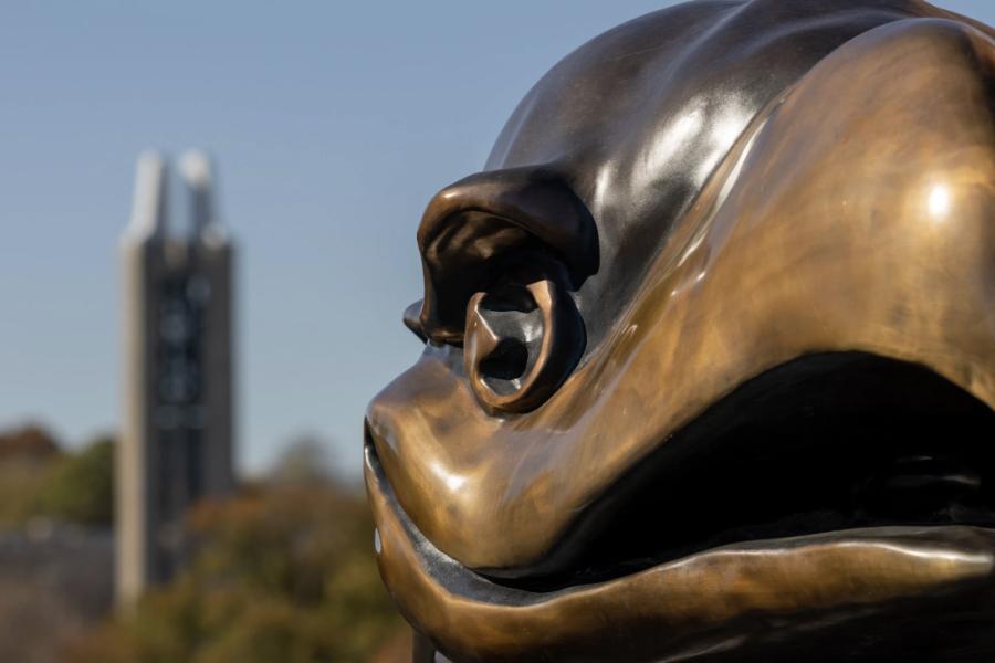 Jayhawk statue with Campanile in the distance at the University of Kansas.