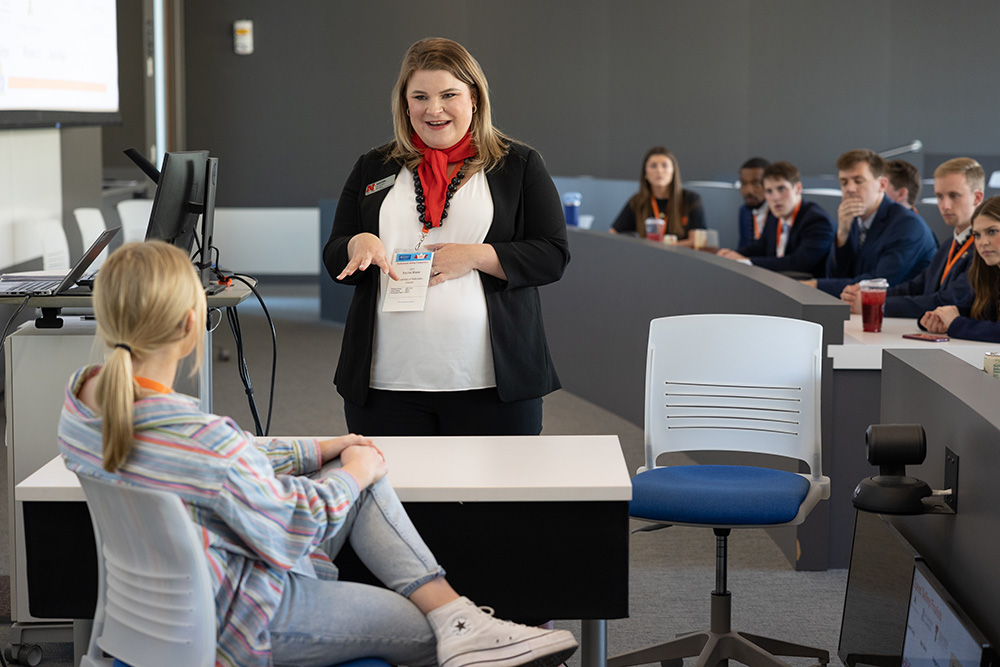 Rachel Blake from the University of Nebraska–Lincoln, pitches to a King’s Hawaiian representative in the speed selling round of the 2023 KU Professional Selling Program/King’s Hawaiian Sales Competition. 