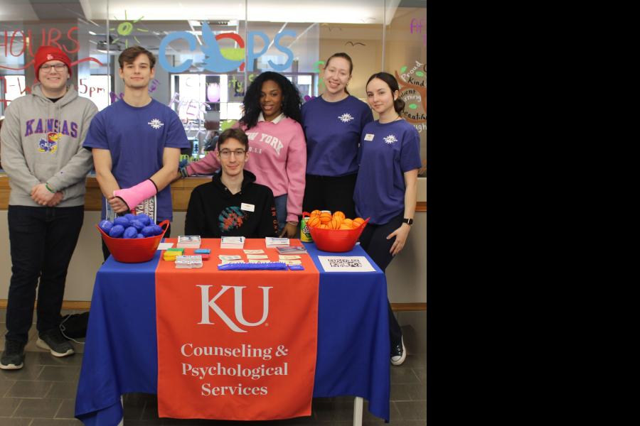 HOPE@CAPS Peer Educators standing outside of the new Peer Community Space in the Kansas Union.