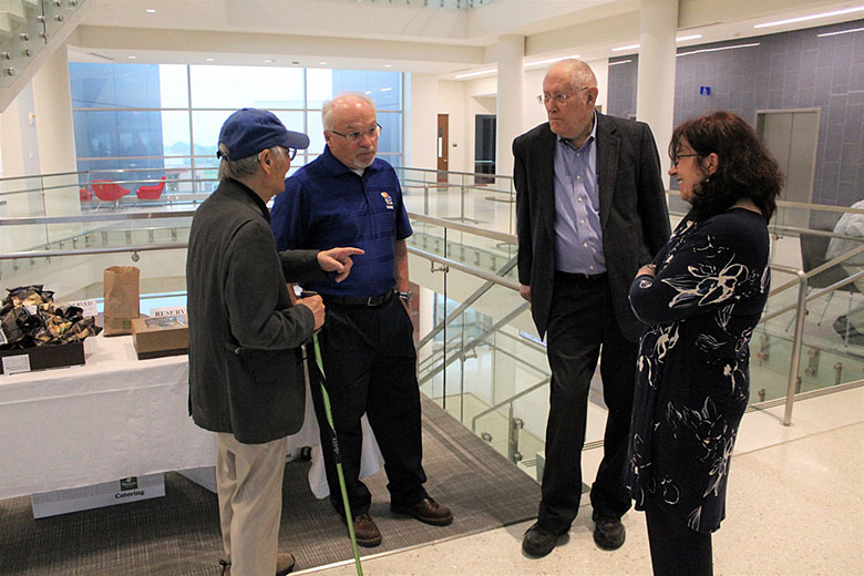 Dr. Maggie Witek enjoys hearing stories from Drs. Kuwana, Soper, and Wilson about Dr. Soper's time as a graduate student under the mentorship of Dr. Kuwana