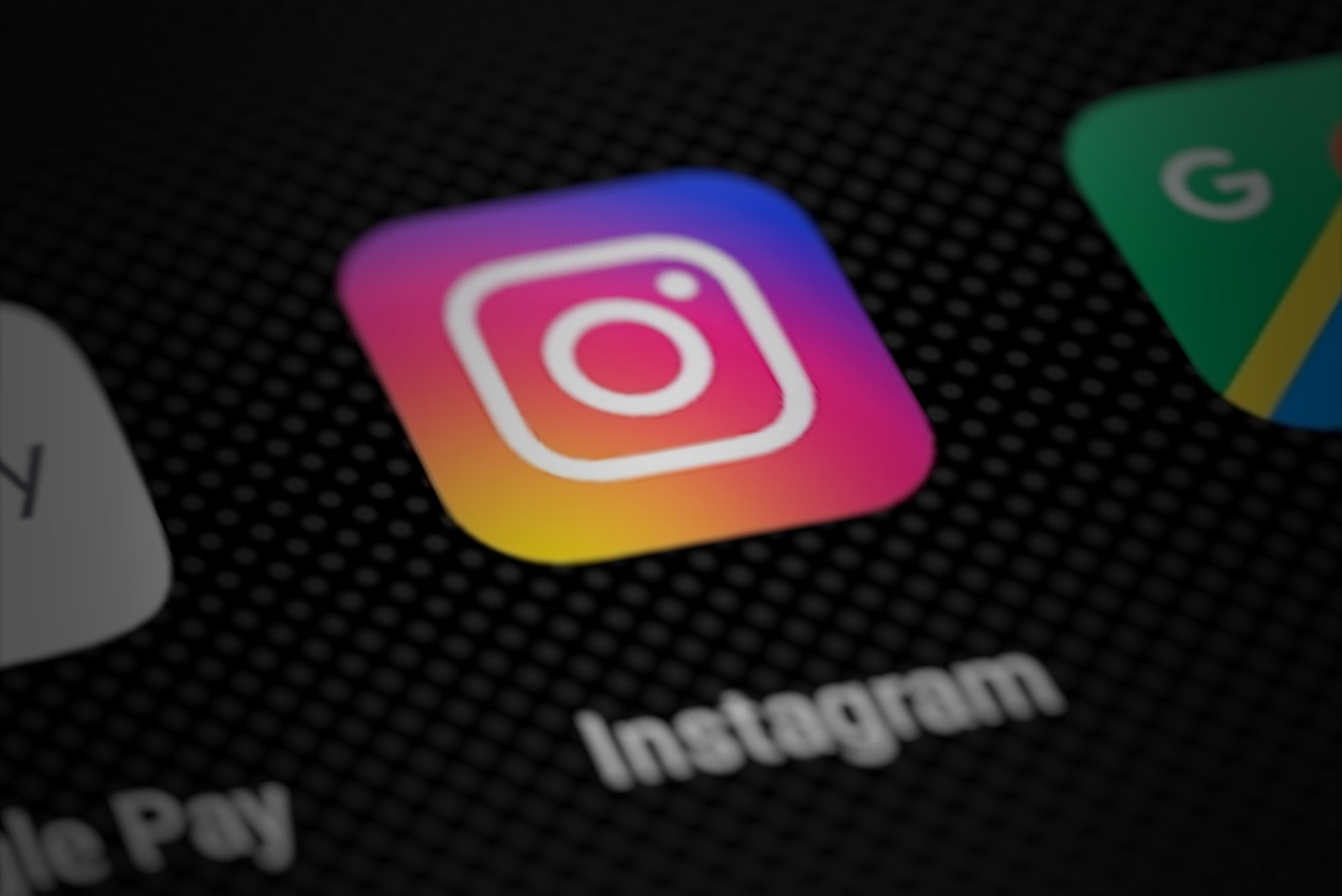 Instagram logo on smartphone screen.