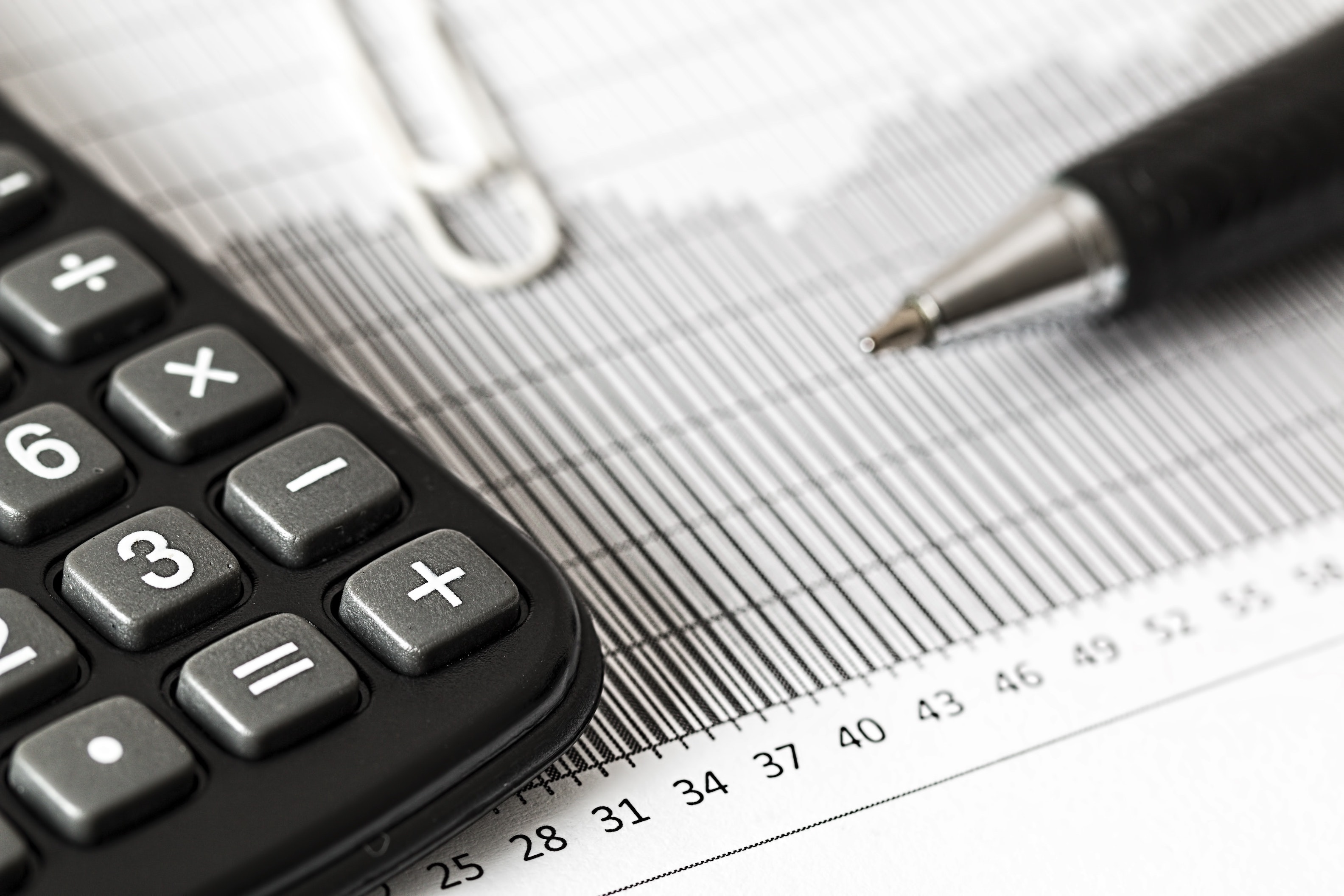 Close up of calculator and pen