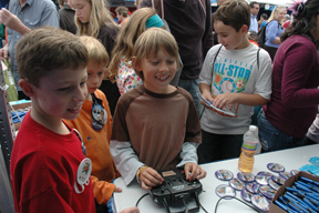 A child flying a simulated remote plane