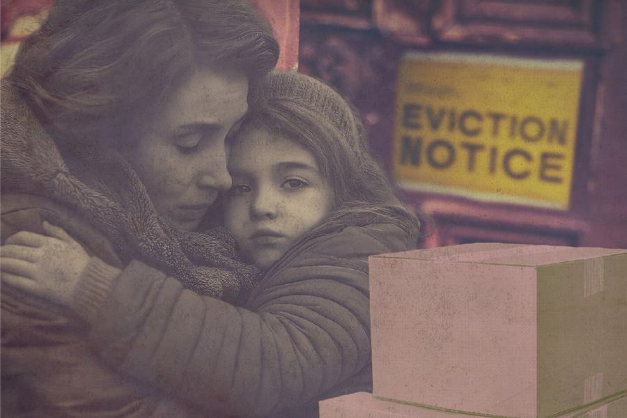 A woman holds her child outside a home marked with an eviction notice next to stacked cardboard boxes