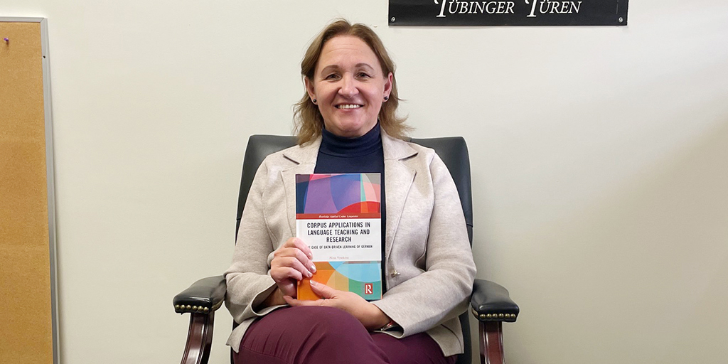 Nina Vyatkina with her new book, "Corpus Applications in Language Teaching and Research: The Case of Data-Driven Learning of German” (Routledge, 2024). Credit: Rick Hellman, KU News Service.