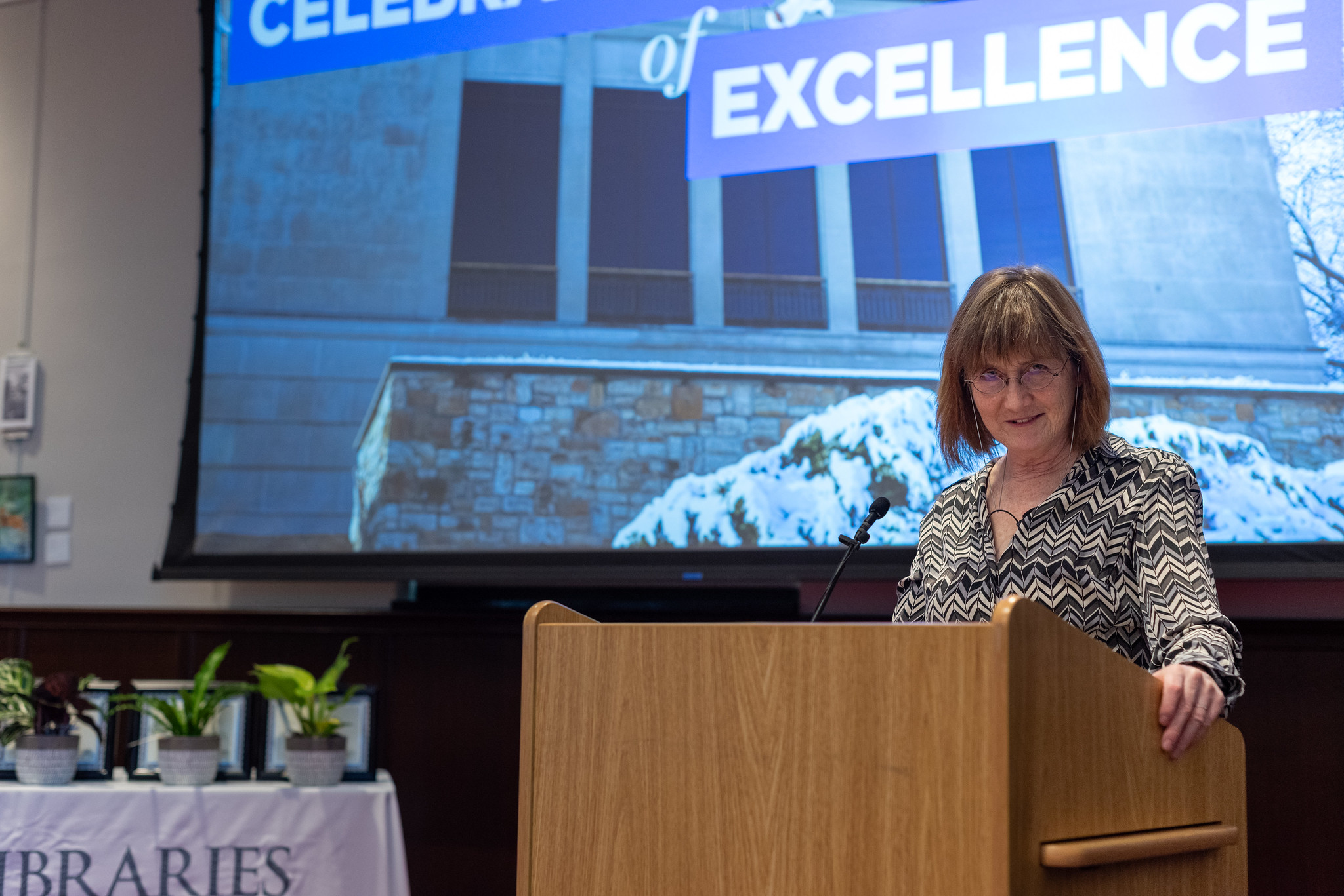 Carol Smith, Dean of KU Libraries, speaks at a podium.
