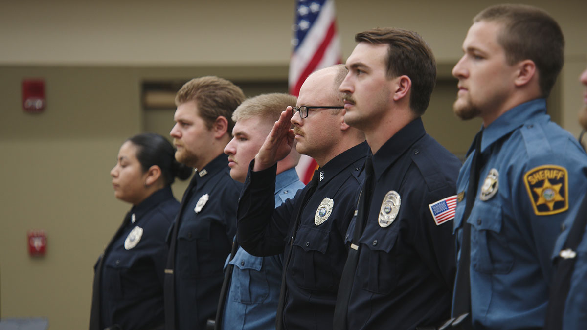 Kansas officers stand at attention during Police Week memorial ceremony.