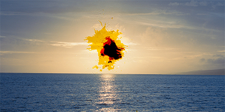 Bright, destructive flare centered over sky and body of water in "I Will Destroy You (21.084176459575733, -157.02758455686487)," by Lilly McElroy. 