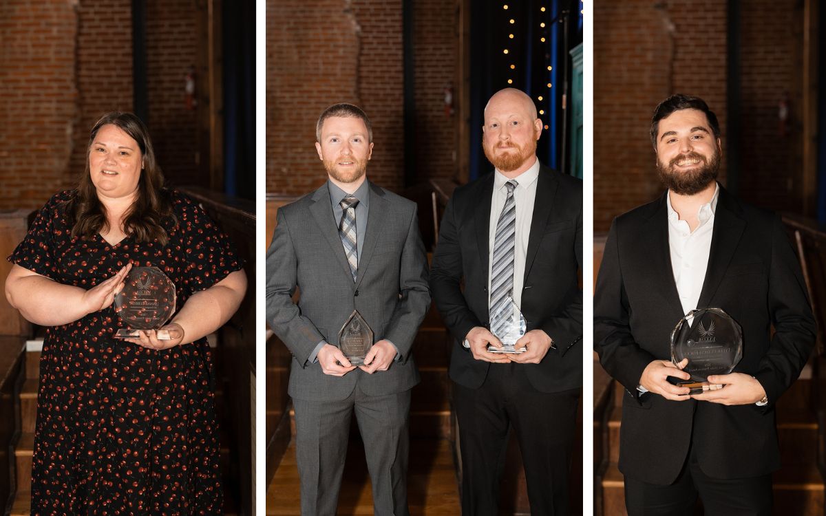 Valor Award recipients Janae Lubega, Joseph Jackson, Eli Hodge and Tyler Ulrich-Hicks hold small plaques.