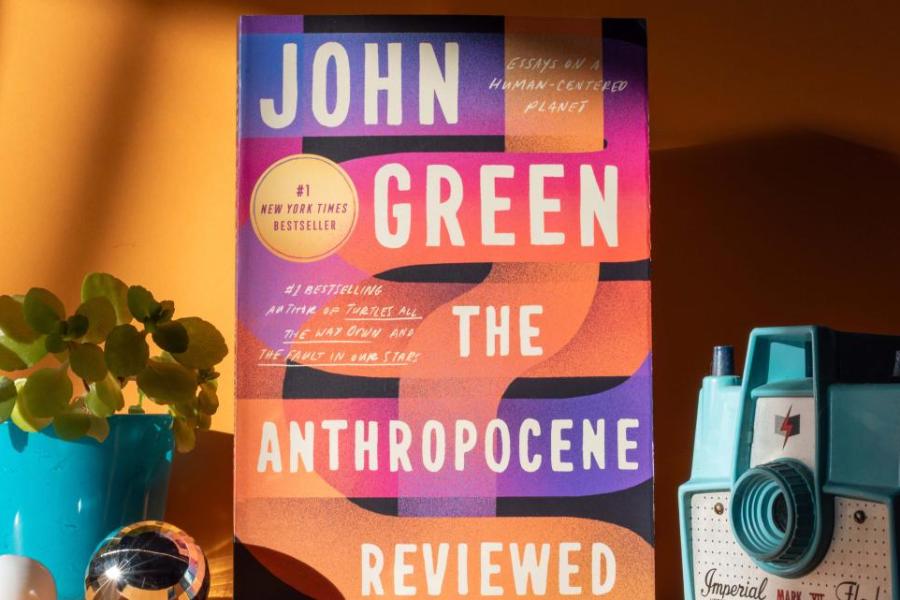 KU's Common Book selection, "The Anthropocene Reviewed" by John Green, a collection of essays, sits among a collection of things.