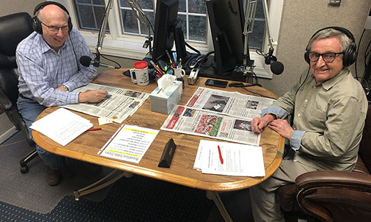 Volunteers Dave Corley and Jim Carnell reading newspapers for Audio-Reader. Photo credit: Meredith Johanning
