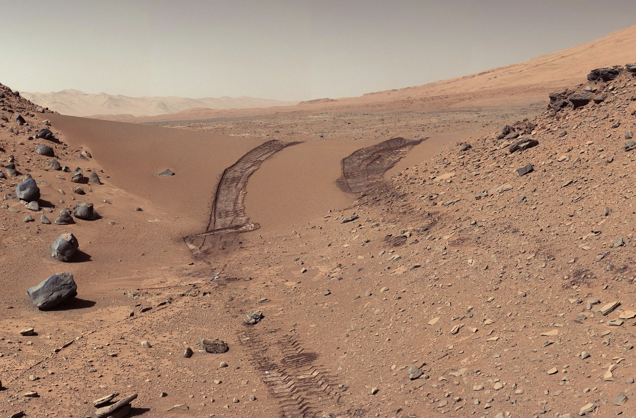 Photo of NASA Mars Curiosity's view of Martian soil and boulders after crossing the "Dingo Gap" sand dune