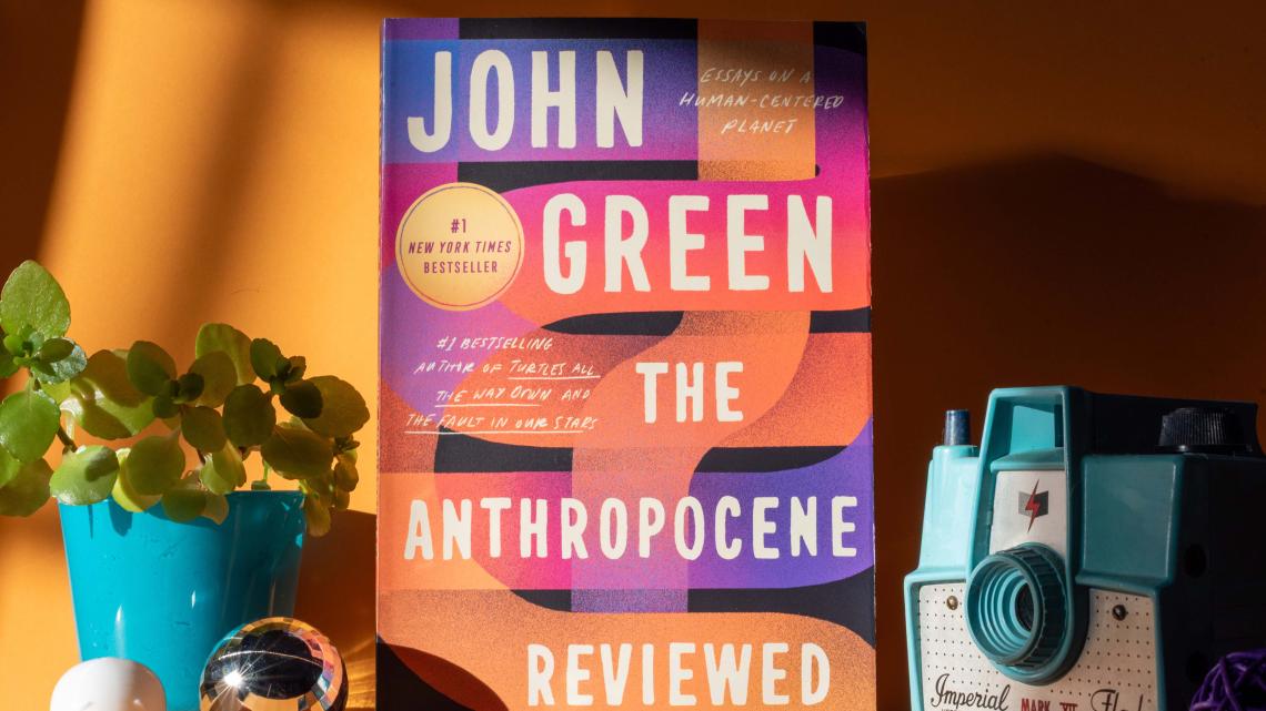 KU's Common Book selection, "The Anthropocene Reviewed" by John Green, a collection of essays, sits among a collection of things.