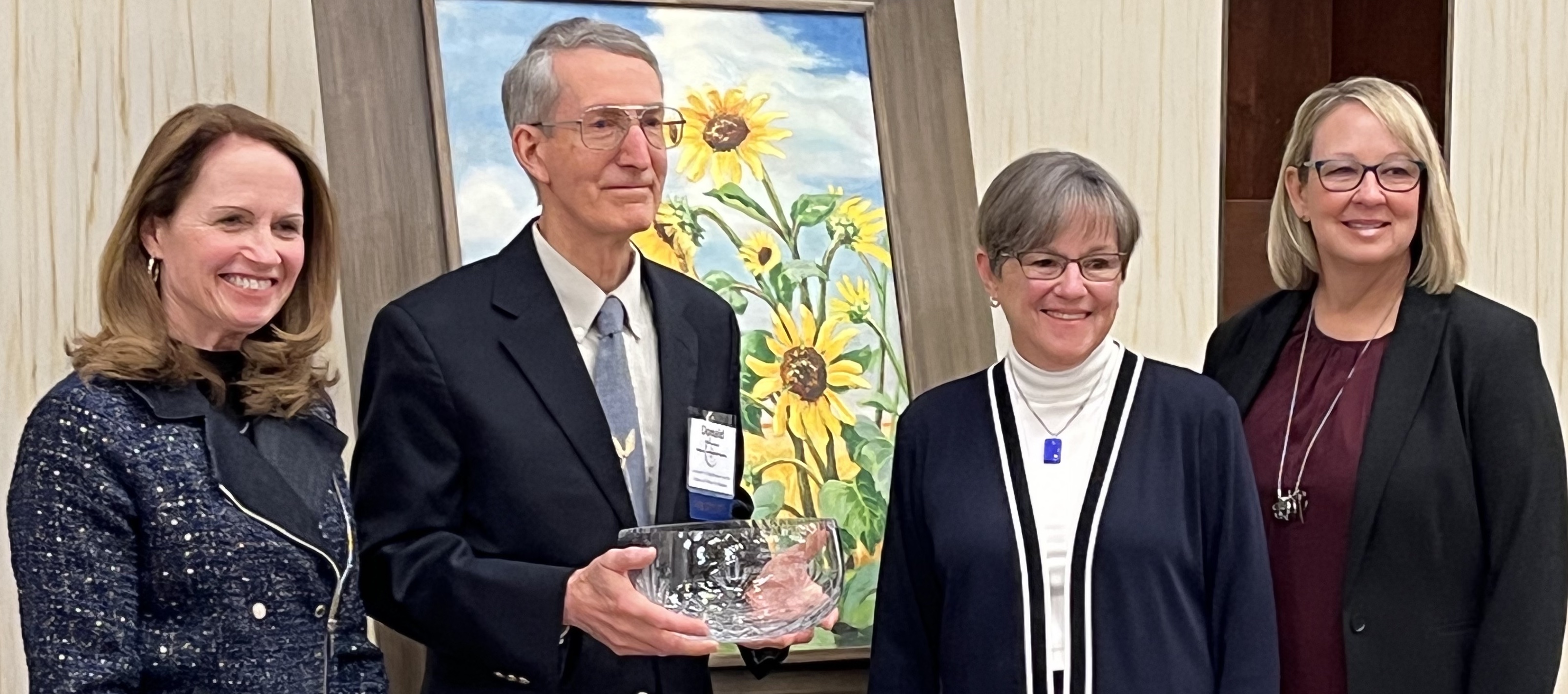 "Connie Owen, director of the Kansas Water Office; Don Whittemore; Kansas Governor Laura Kelly; and Dawn Buehler, chair of the Kansas Water Authority."