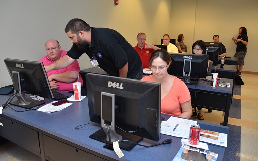 Students part of the KU JayHackers group work with High School Teachers at the First GenCyber Camp 