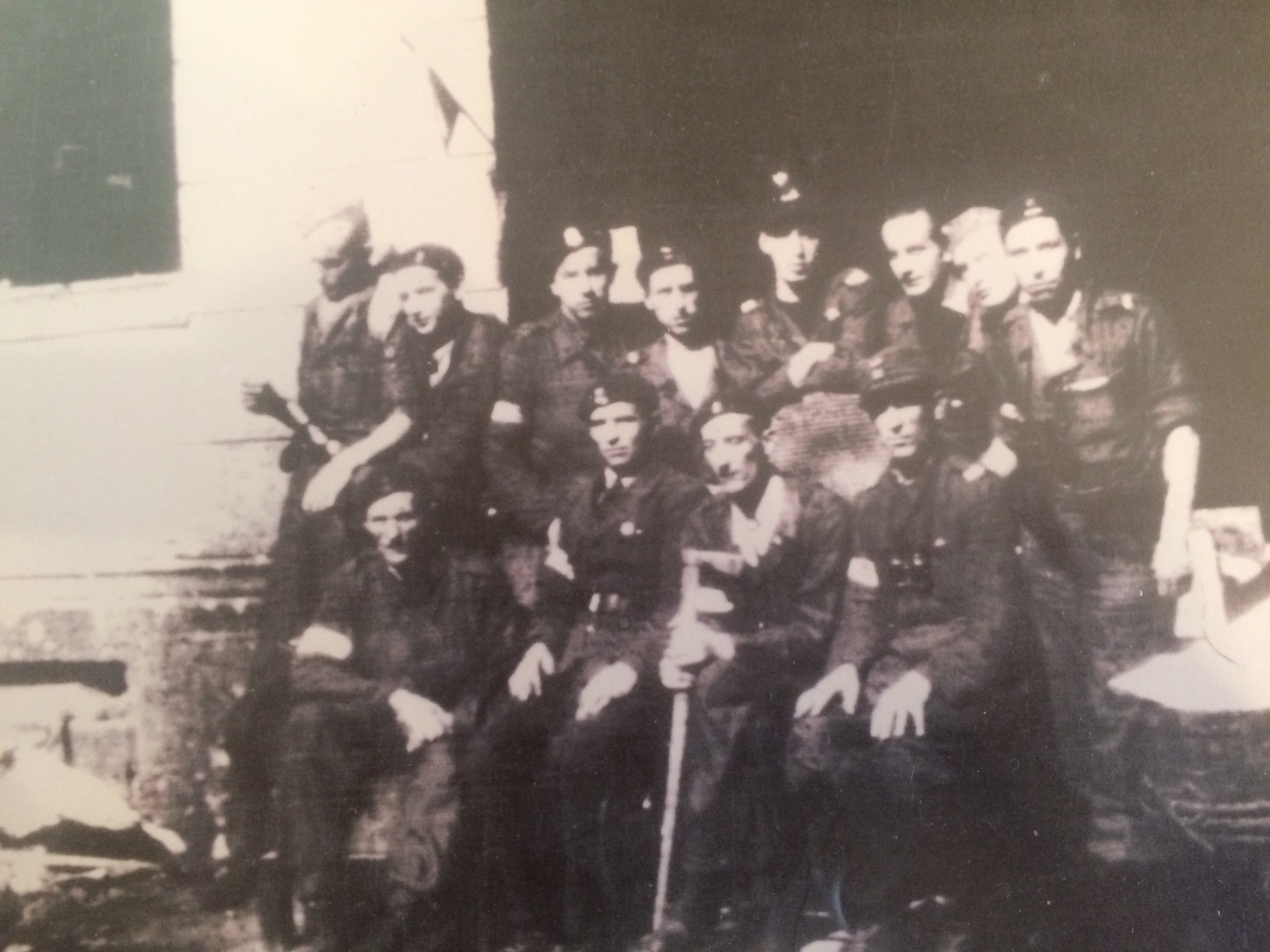 Piekałkiewicz, back row fourth from left, stands with his squad "Krzywda" during the Warsaw Uprising in August 1944. 