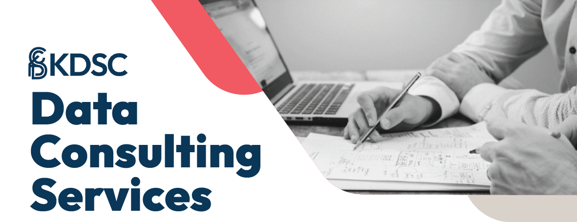 Data consulting services with hand writing on paper next to laptop