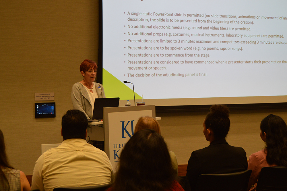Jen Roberts gives the opening remarks at the 2022 KU 3MT competition finals.