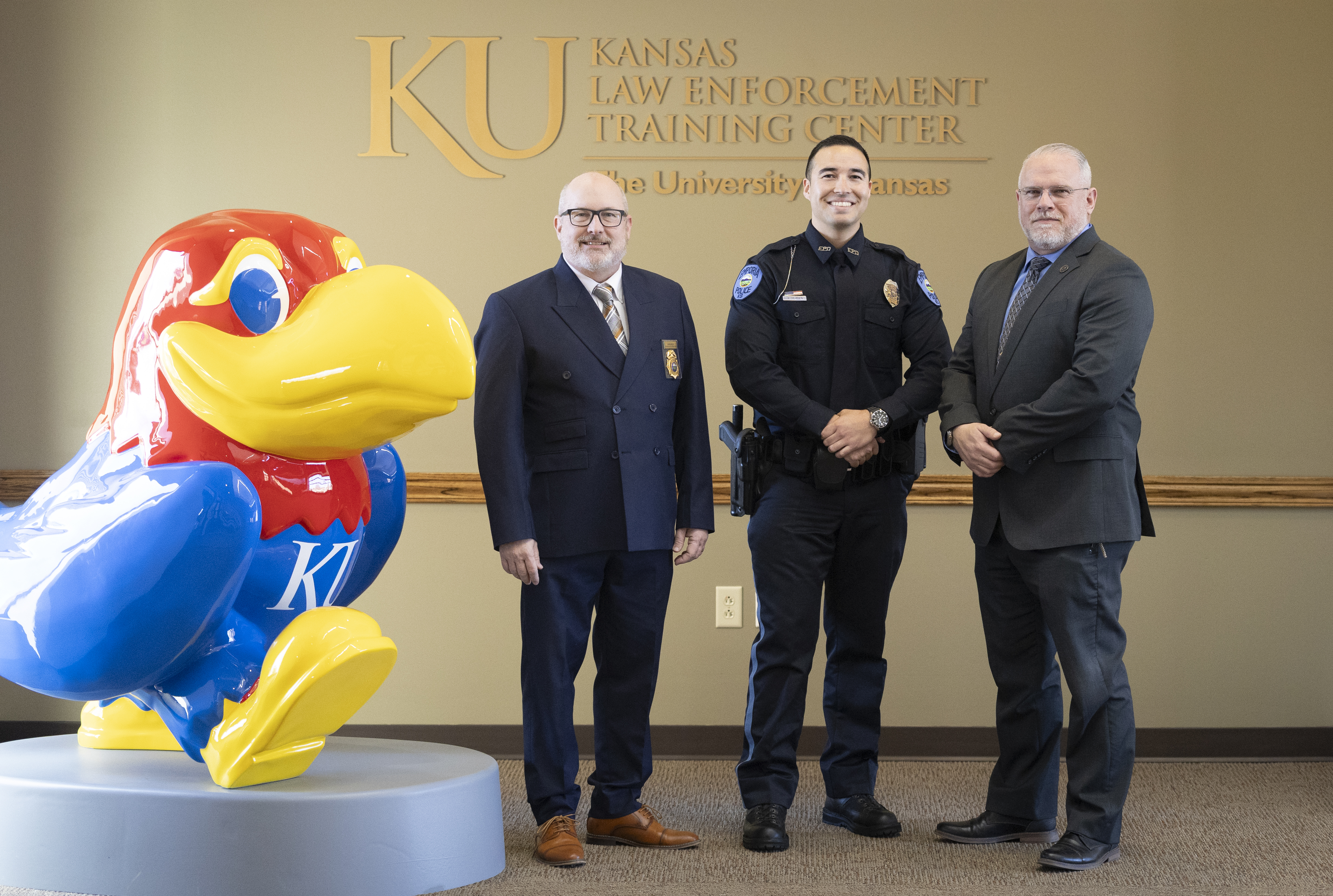 KLETC Vice Provost Darin Beck, Class President Jonathon Slaten, Executive Director of the Kansas Commission on Peace Officers’ Standards and Training Mike Brown.