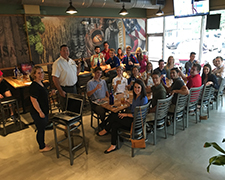 The SELF Fellows and KU alumnus Steven Hurt raise their glasses to the camera after an excellent dinner at Growler USA in Austin, TX.