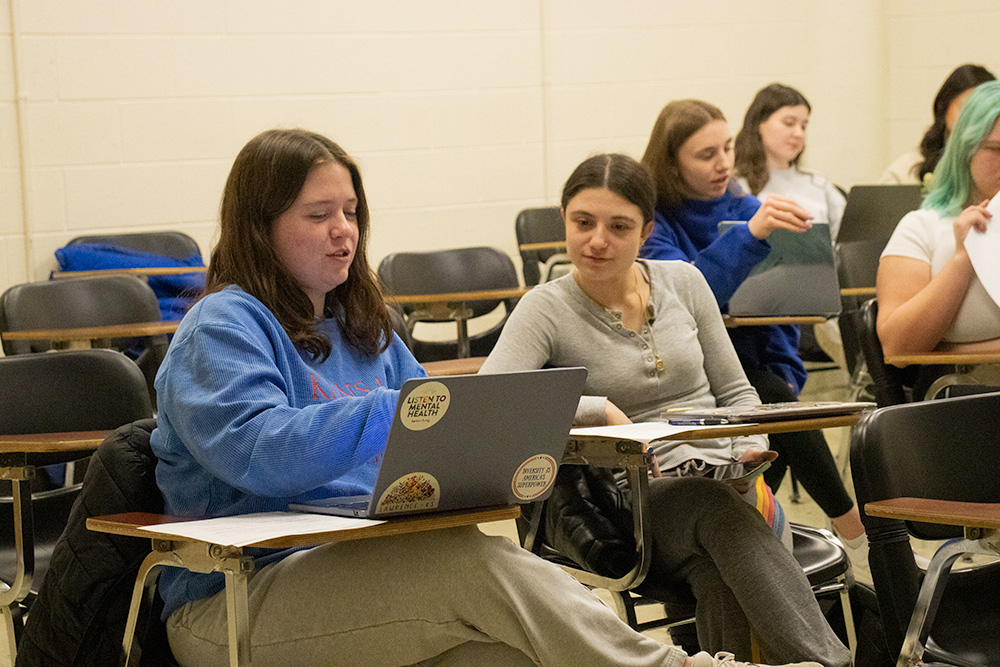 Social Welfare students work on a group assignment during their SW410 410 Professional Writing Skills in Social Work class.