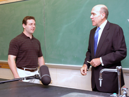 Assistant Professor Michael Detamore, left, learns from KU Provost Richard Lariviere, that he is one of the 2008 Kemper Fellows.