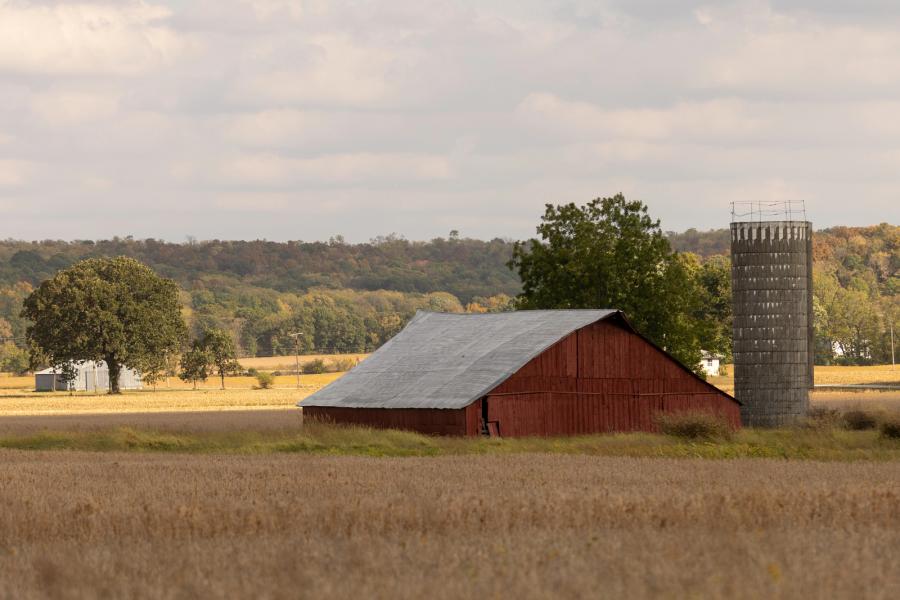 Barn and silo in a field