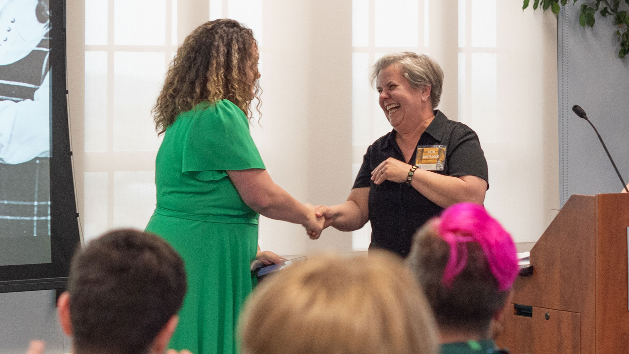 Associate Dean Beth Whittaker congratulates Cara Broel, the undergraduate winner of the Snyder Book Collecting Contest.