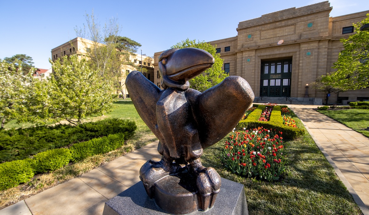 Academic Jay sculpture in front of Strong Hall during spring