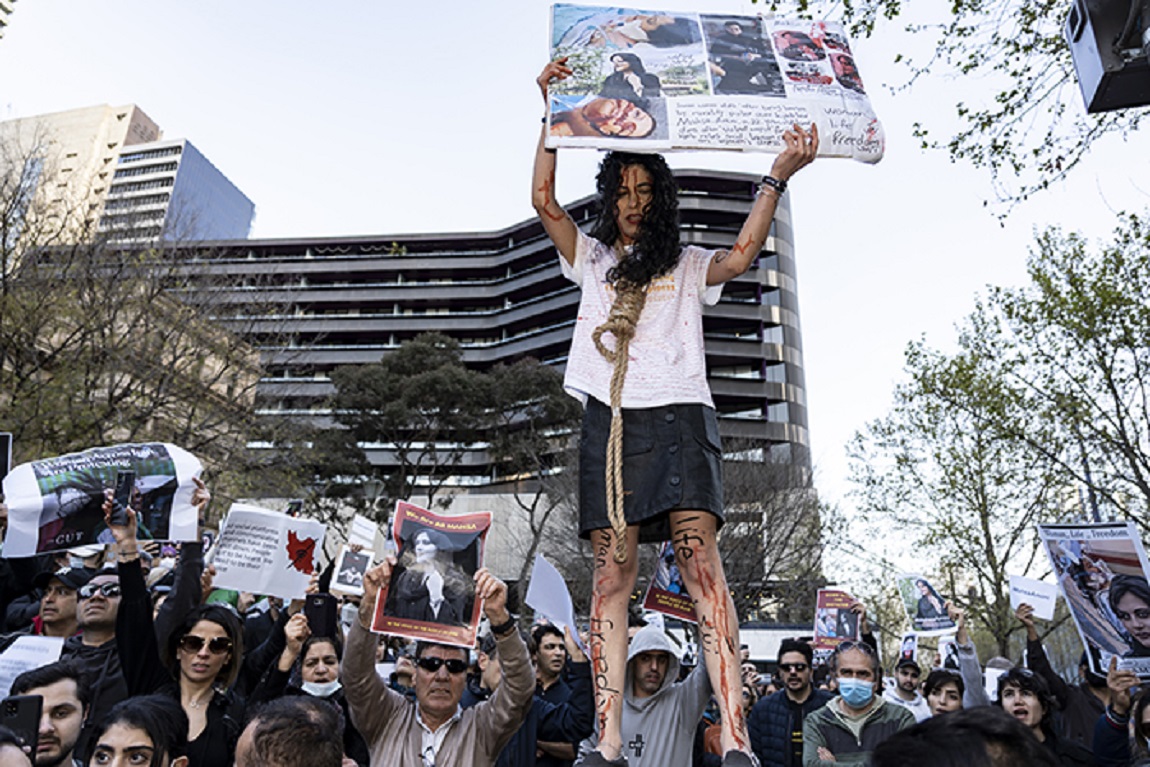 A woman holds a sign and wears a noose during solidarity protests in Melbourne, Australia. The protests were in conjunction with the Iranian women's movement following the death of Mahsa Jina Amini