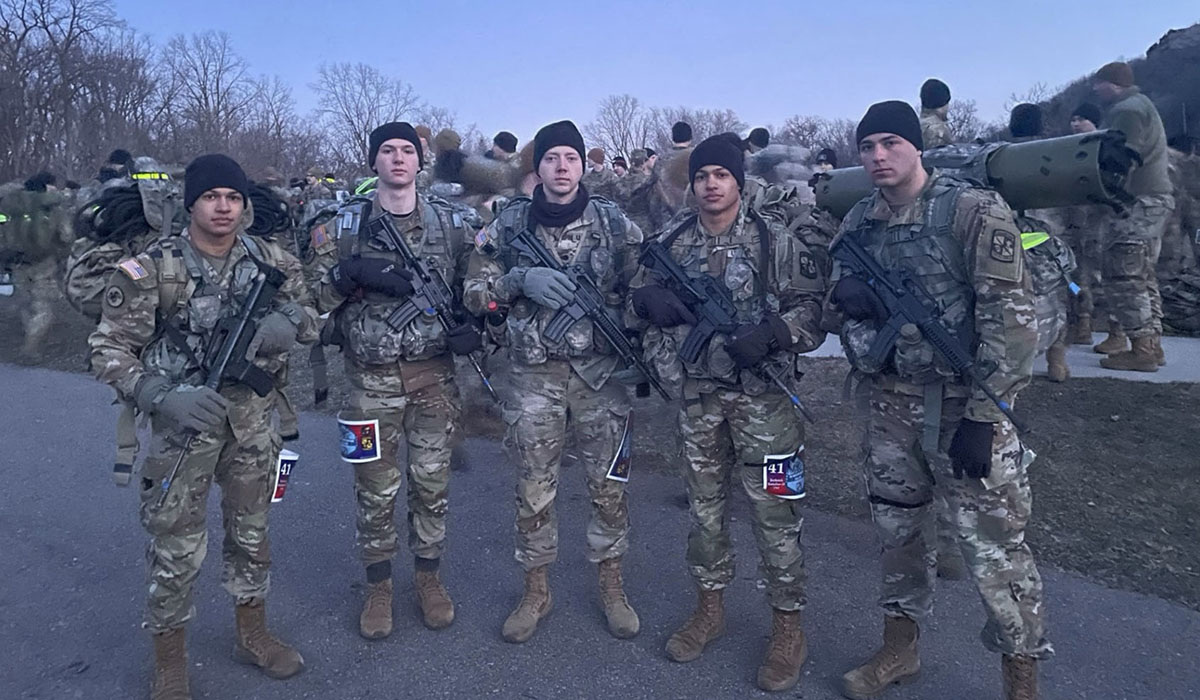In fatigues and holding guns outdoors, Team B cadets, from left, Luke Rogers, Elijah Mortensen, Jairub Constable, Alex Rogers and Jaden Murff.