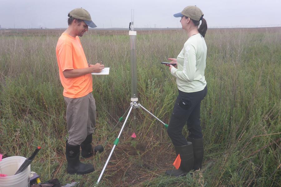 KGS researchers take soil infiltration measurements.