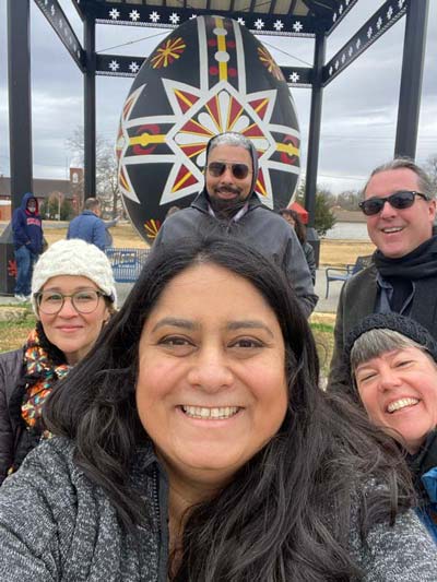 Libraries staff pose in front of the Czech Egg in Wilson, Kansas.