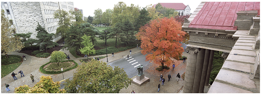 View from the roofline of Lippincott Hall looking down towards a busy Jayhawk Boulevard.