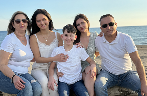 Photo of KU Master of Accounting student Donna Kraja and her family on a beach in Montenegro