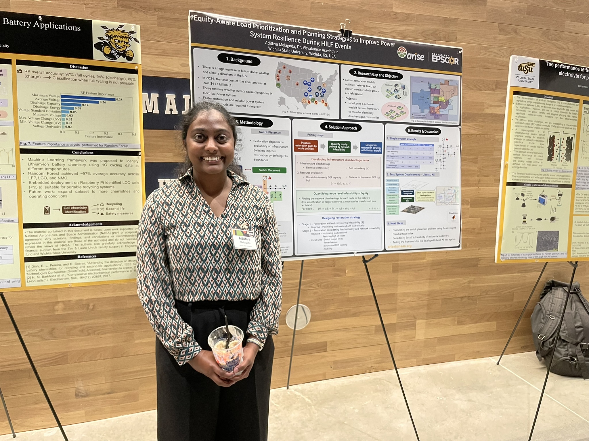 Students stands next to a research poster