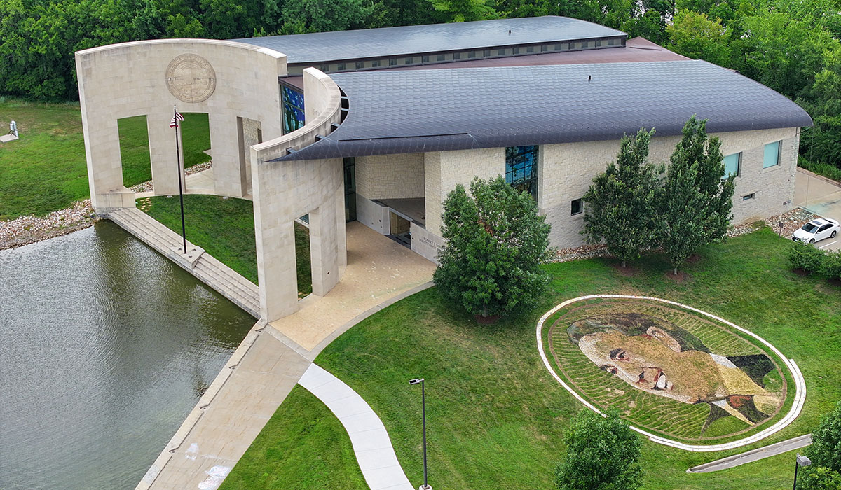 Aerial view of earthwork of Bob Dole adjacent to Dole Institute of Politics, pool of water