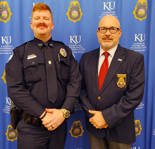 KLETC Executive Director Darin Beck stands with the 285th class president, Officer Grady Carl.