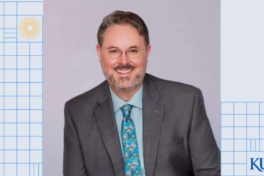Scott McLewin over a light blue background with grid lines and a KU logo in the bottom right corner.