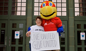 Marianne Reed and Jayhawk mascot.