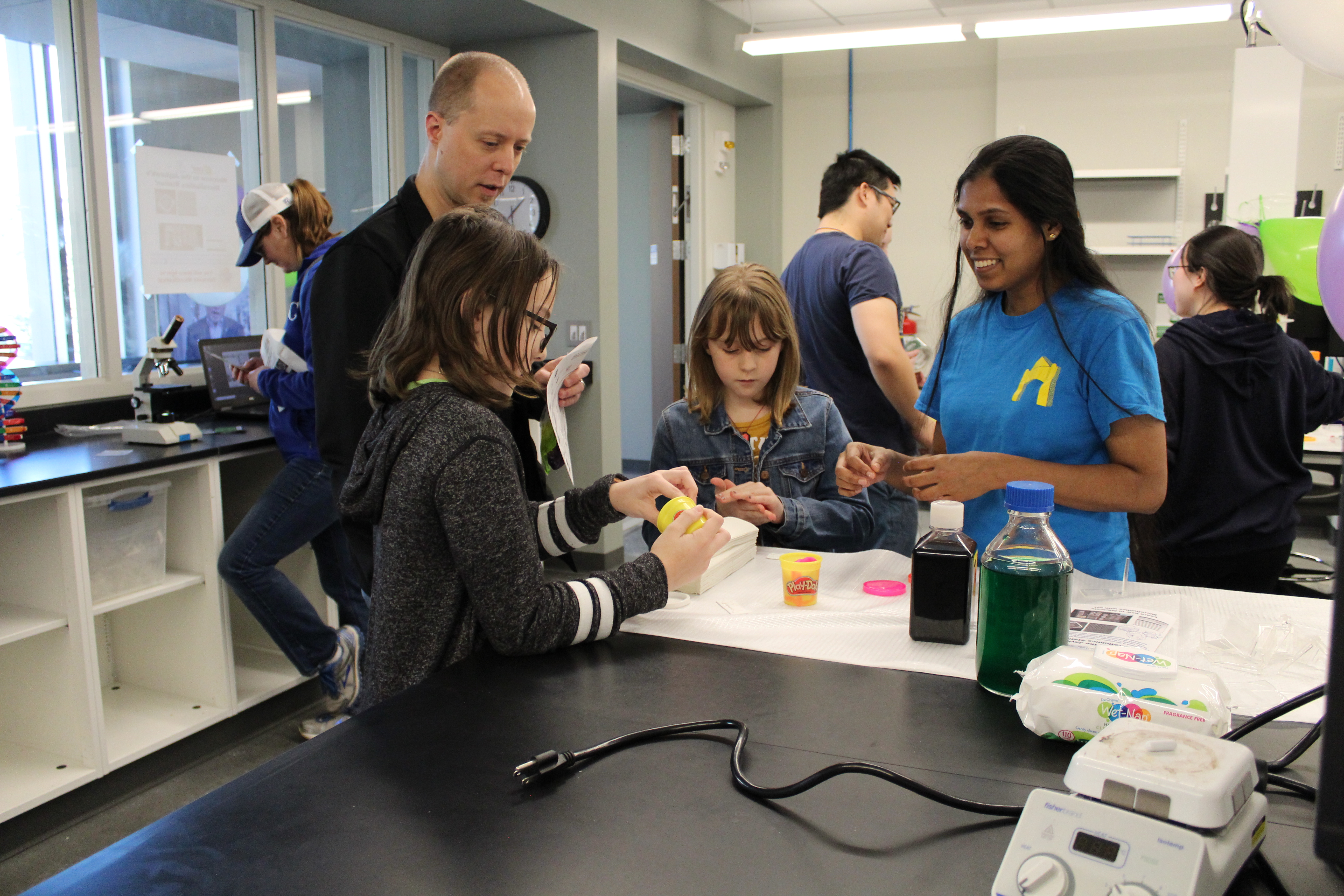 A group of people actively involved in a crafting activity.