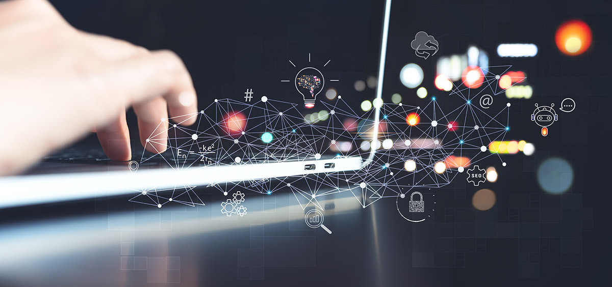 A photo illustration of a hand typing on a laptop with illustrations of technological concepts like AI and connectivity represented.