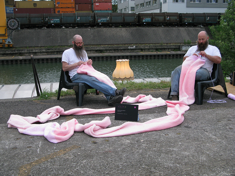 Miller & Shellabarger performing “Untitled (Pink Tube)” in Basel, Switzerland, during VOLTA, 2008. Photo by Deb Sokolow.