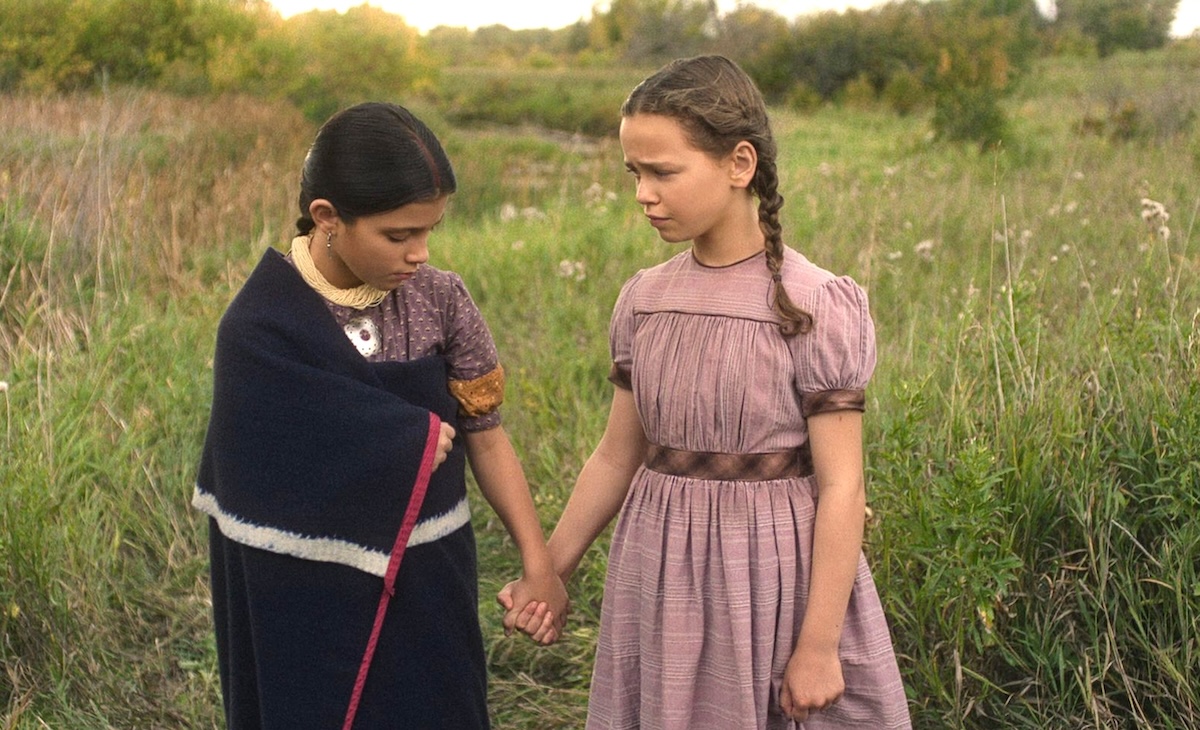 Wren Zhawenim Gotts, left, portrays Good Eagle and Alice Halsey portrays Laura Ingalls in an episode of “Little House on the Prairie.”