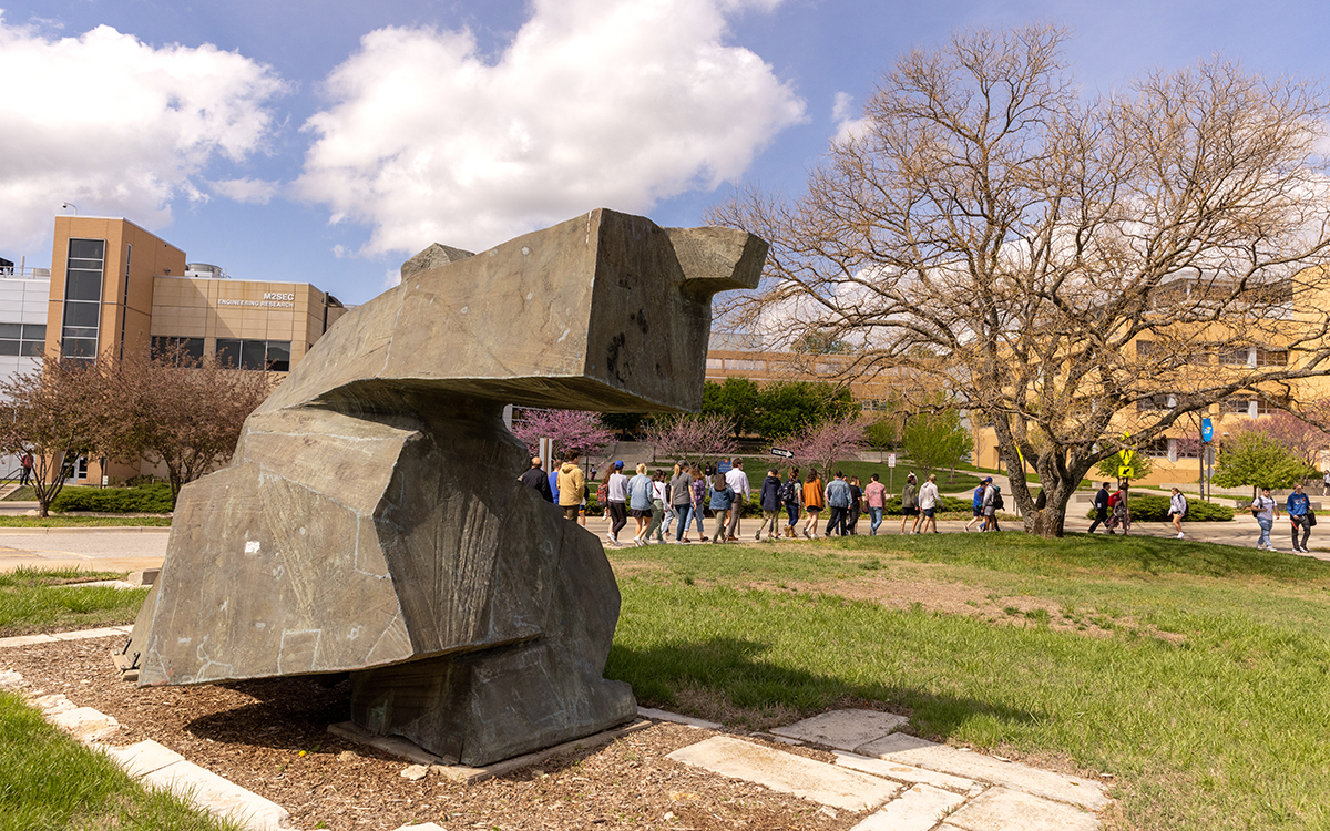 Students walk near Green Hall, home to the KU schools of Law and Social Welfare.