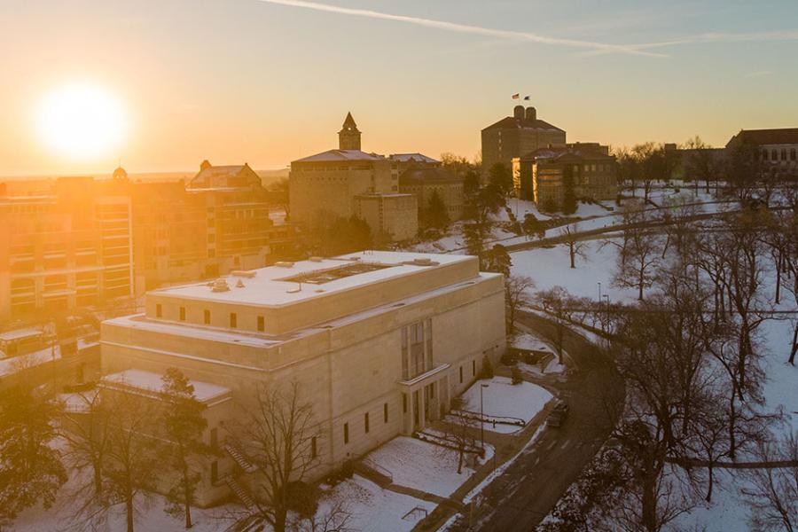 Aerial view of snowy campus scene with Strong Hall in view.