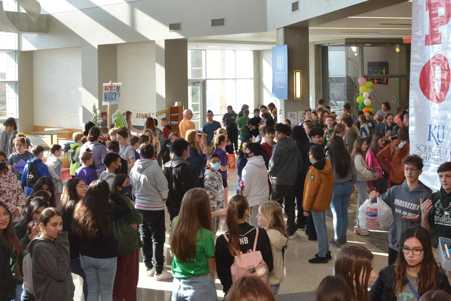 Students mill about large atrium for Engineering Expo event at KU.