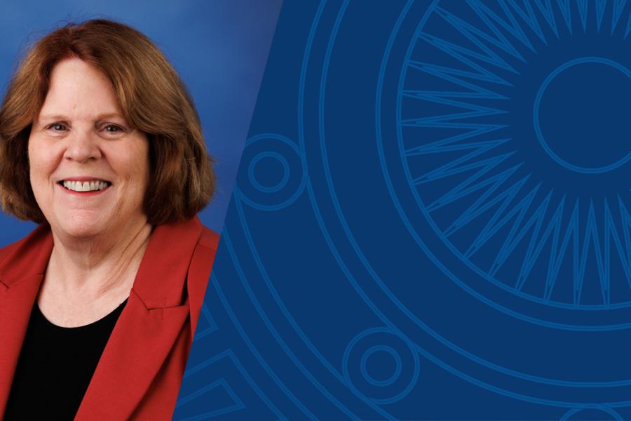 Portrait of Robin Lehman, director of faculty recognition & awards, next to a dark blue geometric background.