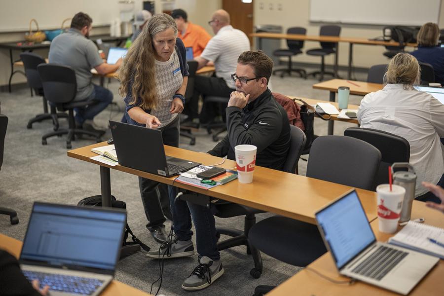 Dr. Heather McCain helps an attendee during her Lean Six Sigma Green Belt class at KU Edwards Campus in Overland Park, KS, April 10, 2026.