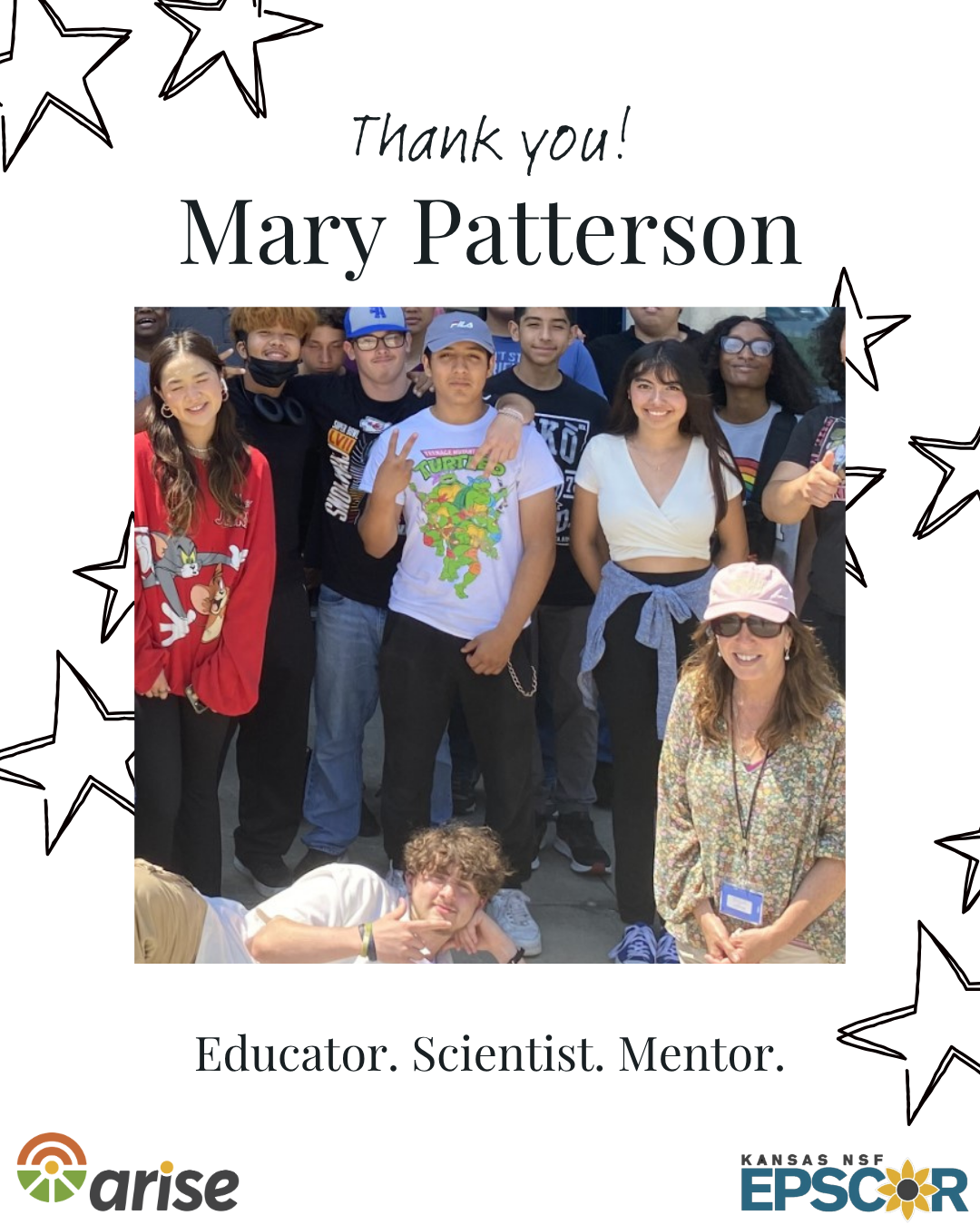 Group of teenagers smiling with Dr. Patterson